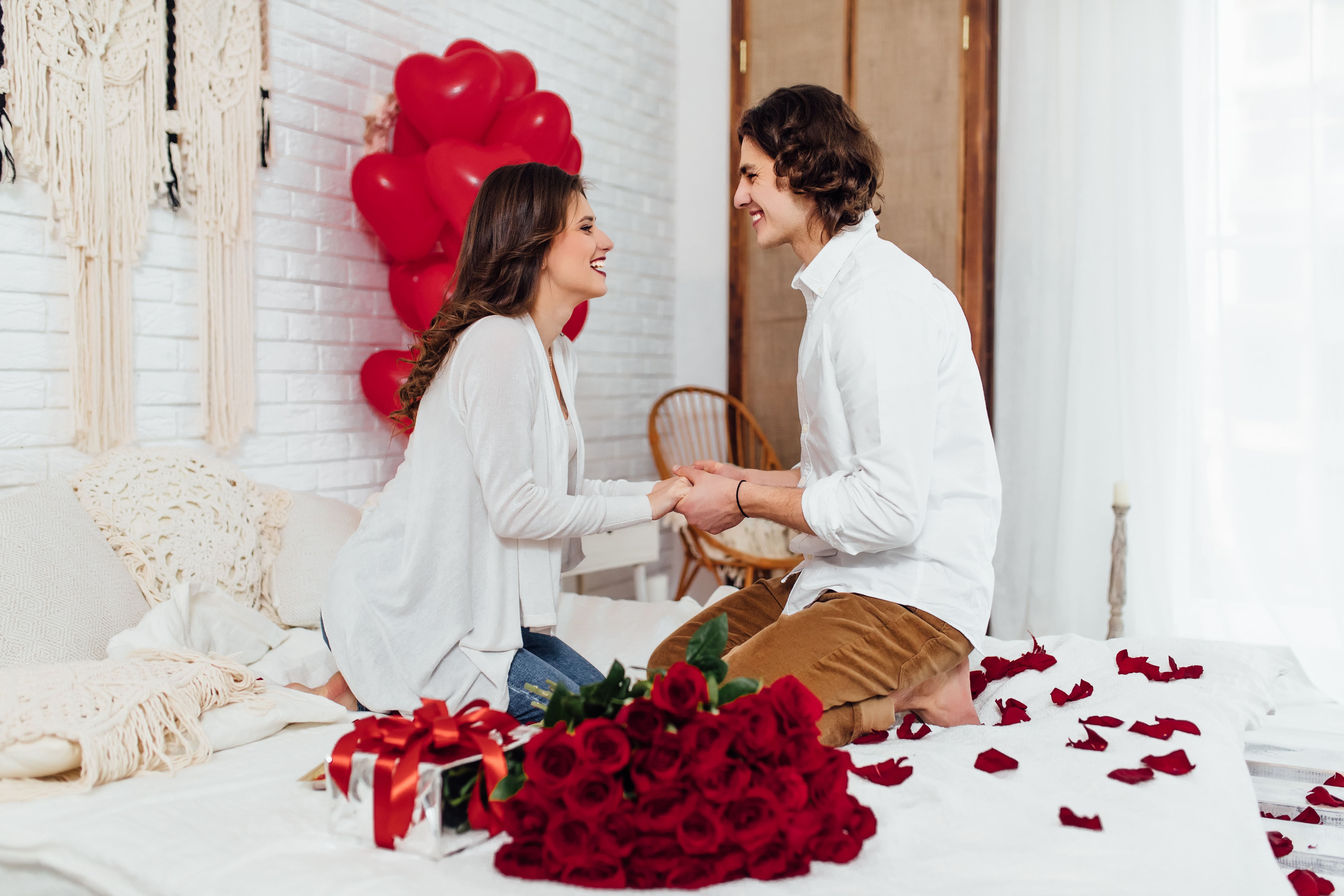 happy couple holding hands after proposal